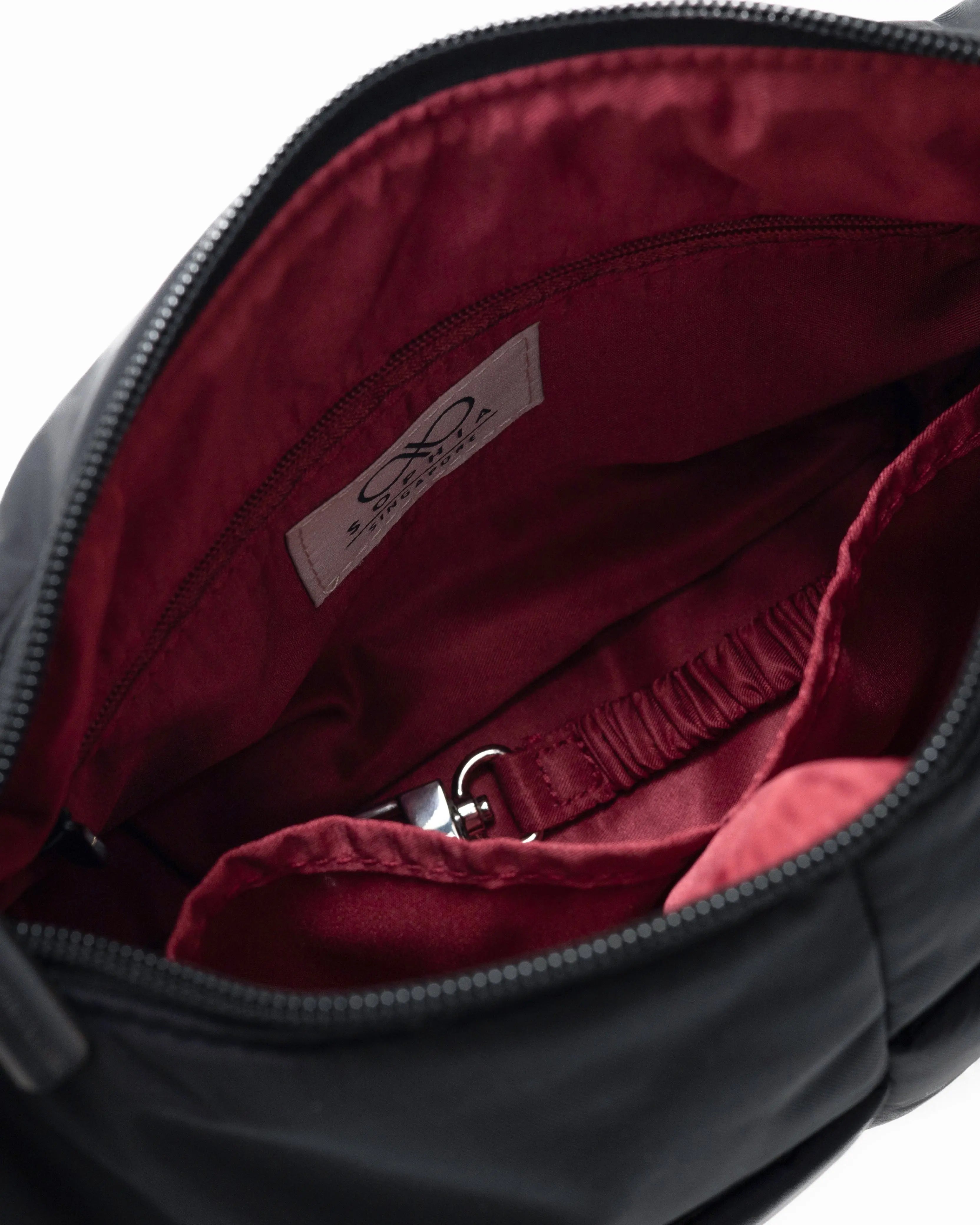 MINI SIGNATURE POCKET CROSSBODY BAG IN POSH JET BLACK