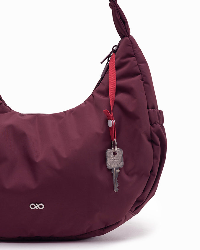 L POSH CRESCENT BAG IN WINE