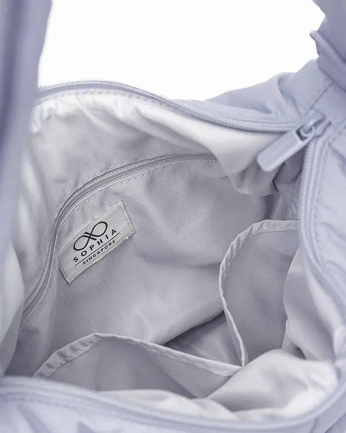 SIGNATURE POCKET CROSSBODY BAG IN COSY LUXE LILAC