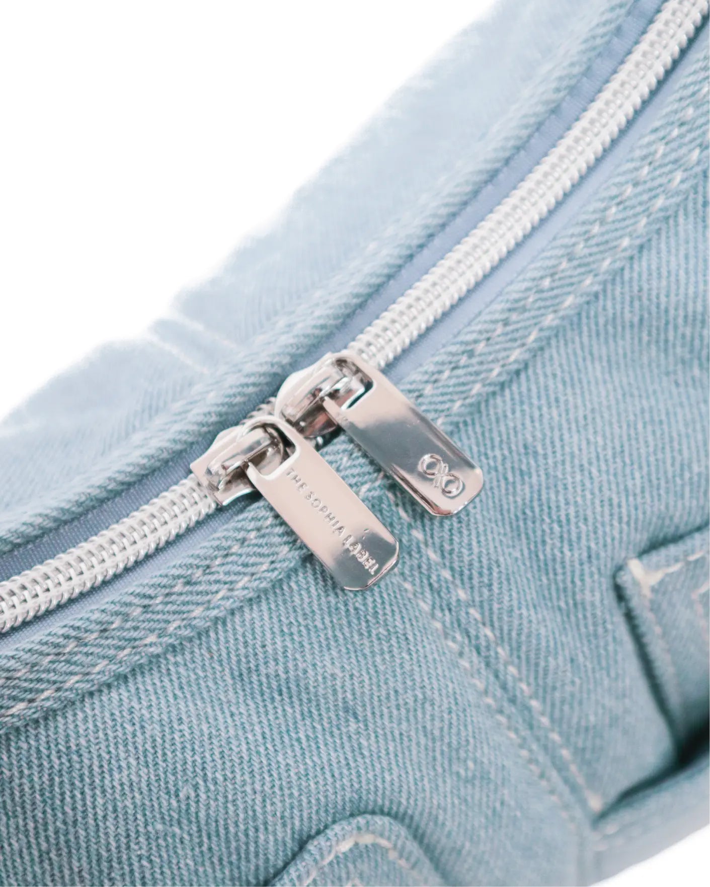 SIGNATURE POCKET HOBO BAG IN LIGHT WASH DENIM TSL Singapore