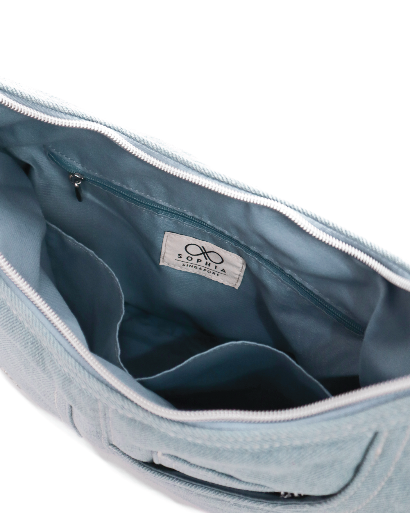 SIGNATURE POCKET HOBO BAG IN LIGHT WASH DENIM